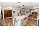Spacious kitchen island featuring drawers, cabinets, and microwave with an entrance to the home at 225 Temple Cir, Eustis, FL 32726