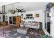 Bright sunroom with a comfortable sofa, stylish rug, and sliding glass doors, perfect for enjoying indoor-outdoor living at 225 Temple Cir, Eustis, FL 32726