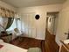 Cozy bedroom with window, closet space, and floral patterned window valances at 2429 S Laurel Ave, Sanford, FL 32771