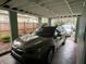 Carport with a dark green SUV parked, providing sheltered parking at 2429 S Laurel Ave, Sanford, FL 32771