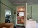 View from an entryway with a glimpse into the dining area and access to the garage at 2429 S Laurel Ave, Sanford, FL 32771