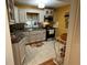 Bright kitchen features white cabinets, stainless steel appliances, and tile backsplash at 2429 S Laurel Ave, Sanford, FL 32771