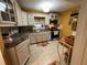 Bright kitchen featuring white cabinets, stainless steel appliances, and tile backsplash at 2429 S Laurel Ave, Sanford, FL 32771
