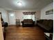 Inviting living room features hardwood floors, classic decor, and plenty of seating at 2429 S Laurel Ave, Sanford, FL 32771