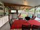 Spacious patio with outdoor seating and stainless steel grill overlooking backyard at 2429 S Laurel Ave, Sanford, FL 32771