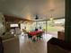 Open patio featuring a dining area, outdoor seating, grill, and backyard views at 2429 S Laurel Ave, Sanford, FL 32771