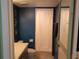 Traditional bathroom with blue walls, vanity and standard shower behind white curtain at 25210 Northlake Dr # 210, Sanford, FL 32773