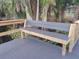Inviting wooden bench on the deck, a perfect spot for relaxation near the tranquil water at 25210 Northlake Dr # 210, Sanford, FL 32773