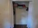 Spacious closet with shelving and hanging space behind simple white curtain at 25210 Northlake Dr # 210, Sanford, FL 32773