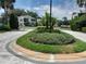 Well-maintained community entrance with attractive landscaping and inviting street view at 25210 Northlake Dr # 210, Sanford, FL 32773