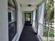 Outdoor hallway with windows and railings at 25210 Northlake Dr # 210, Sanford, FL 32773