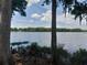 Calm lake view through trees showcasing the natural beauty and peaceful environment at 25210 Northlake Dr # 210, Sanford, FL 32773