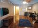 Spacious living room with hardwood floors, fireplace and fan at 25210 Northlake Dr # 210, Sanford, FL 32773