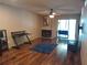 Spacious living room with hardwood floors, fireplace and fan at 25210 Northlake Dr # 210, Sanford, FL 32773