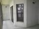 Screened in porch featuring exterior window, porch lighting, view of partial exterior door and screening at 25210 Northlake Dr # 210, Sanford, FL 32773