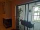 Covered porch featuring an outdoor fan, chairs, and sliding glass doors to interior and porch view at 25210 Northlake Dr # 210, Sanford, FL 32773