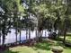 Beautiful water view framed by mature trees and lush green space at 25210 Northlake Dr # 210, Sanford, FL 32773