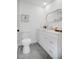 Clean bathroom with modern fixtures, including a sleek toilet, vanity, and lighting at 2541 Leeward Way, Winter Park, FL 32792