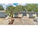Charming single-story home with modern blue exterior, well-kept front yard, and mature palm trees at 2541 Leeward Way, Winter Park, FL 32792