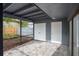 Enclosed patio featuring gray brick flooring, with two convenient storage closets and access to the backyard at 2541 Leeward Way, Winter Park, FL 32792