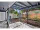Screened porch with view of fenced backyard at 2541 Leeward Way, Winter Park, FL 32792