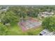 Ariel view of the community's tennis courts, surrounded by mature trees and green landscaping at 2541 Leeward Way, Winter Park, FL 32792