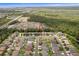 Aerial view of the property and the surrounding area with lush greenery at 2604 Bullion Loop, Sanford, FL 32771
