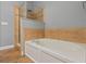Bathroom showcasing a soaking tub with a tiled backsplash and a separate tiled shower at 2604 Bullion Loop, Sanford, FL 32771