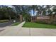 Entrance to Sterling Meadows community featuring a brick sign and well-maintained landscaping at 2604 Bullion Loop, Sanford, FL 32771