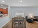 Open dining area with wood floors, seamlessly connecting to the kitchen and living space at 2604 Bullion Loop, Sanford, FL 32771