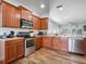 Stylish kitchen featuring stainless steel appliances and ample cabinet space at 2604 Bullion Loop, Sanford, FL 32771