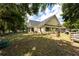 Lovely home exterior with a well-maintained lawn, storage shed, and patio area for outdoor entertainment at 2707 Carmel Ct, Kissimmee, FL 34746