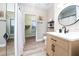 Updated bathroom featuring modern fixtures and an open walk-in closet at 2707 Carmel Ct, Kissimmee, FL 34746