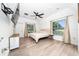 Bright bedroom featuring ceiling fan and large windows at 2707 Carmel Ct, Kissimmee, FL 34746