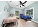 Cozy bedroom featuring ceiling fan and natural light at 2707 Carmel Ct, Kissimmee, FL 34746