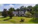 Charming single Gathering home featuring a well-manicured lawn, tidy landscaping, and inviting front porch at 2707 Carmel Ct, Kissimmee, FL 34746