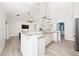 Spacious open kitchen featuring granite countertops, stainless steel appliances, and modern lighting at 2707 Carmel Ct, Kissimmee, FL 34746