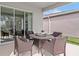 Relaxing patio with outdoor seating, perfect for enjoying the backyard views, creating a welcoming outdoor living space at 2927 Believe In Yourself Ct, Clermont, FL 34714