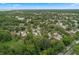 An aerial view of a quiet residential neighborhood with mature trees and winding streets at 309 Kirkcaldy Dr, Winter Springs, FL 32708