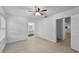 Bedroom featuring tiled floors, a ceiling fan, a window, an ensuite bathroom, and a closet at 309 Kirkcaldy Dr, Winter Springs, FL 32708