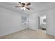 Bedroom featuring tiled floors, a ceiling fan, a window, and an ensuite bathroom at 309 Kirkcaldy Dr, Winter Springs, FL 32708