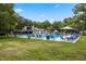 Community pool area with lush landscaping and ample seating, great for outdoor enjoyment at 309 Kirkcaldy Dr, Winter Springs, FL 32708