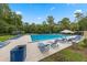 Community pool with ample seating and shade, perfect for relaxation at 309 Kirkcaldy Dr, Winter Springs, FL 32708