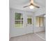 Bright dining area with tile floors, a ceiling fan, a window view of the backyard, and backyard access at 309 Kirkcaldy Dr, Winter Springs, FL 32708