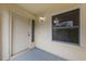 Inviting front porch featuring a classic white door, window and sconce light at 309 Kirkcaldy Dr, Winter Springs, FL 32708
