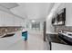 Bright kitchen featuring white countertops, stainless steel appliances, and modern finishes at 309 Kirkcaldy Dr, Winter Springs, FL 32708