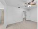 Main bedroom featuring tiled floors, a ceiling fan, an ensuite bathroom, and closet access at 309 Kirkcaldy Dr, Winter Springs, FL 32708