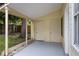 Covered patio with storage closets, offering a versatile outdoor space at 309 Kirkcaldy Dr, Winter Springs, FL 32708