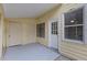 Rear covered patio includes white door and window at 309 Kirkcaldy Dr, Winter Springs, FL 32708