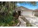 Charming single-story home featuring a two-car garage, landscaped yard, and inviting front entrance at 3121 Natoma Way, Orlando, FL 32825
